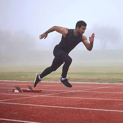 Photo of an athlete sprinting on a track.